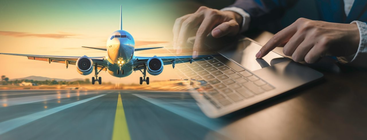 An aeroplane taking off and a man with a laptop